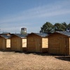 \"Nijmegen, 30-5-2011 . Houten tuinhuisjes op een terrein naast de Vasim. Dit wordt de camping voor bij het Odd-Stream festival.\"