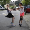 Flora( blond) en Fatou ( donkere krullen) op hun heelyes, of wheelies, van die wieltjes onder je schoenen. Nijmegen, 8-6-2016 .