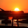 Ondergaande zon met brug, trein, centrale. Nijmegen, 26-8-2016 .