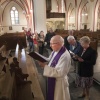 kruiswegstatie in kerk Lent (Maria Geboortekerk). Priester Frank Bomans gaat voorop, . Nijmegen, 14-4-2017 .