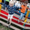 \"Nijmegen, 22-7-2010 . Zomerfeesten, Vierdaagse Siem en Mats springen van de rups\"