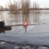 \"Ooy Ooyse banddijk, Waalwater in tuin fam van t Veld.\"