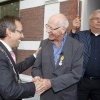 \"Nijmegen, 8-10-2011 . Onthulling plaquette 40 jaar COC. Jos Kocken krijgt ko, lintje van Jan vd Meer\"